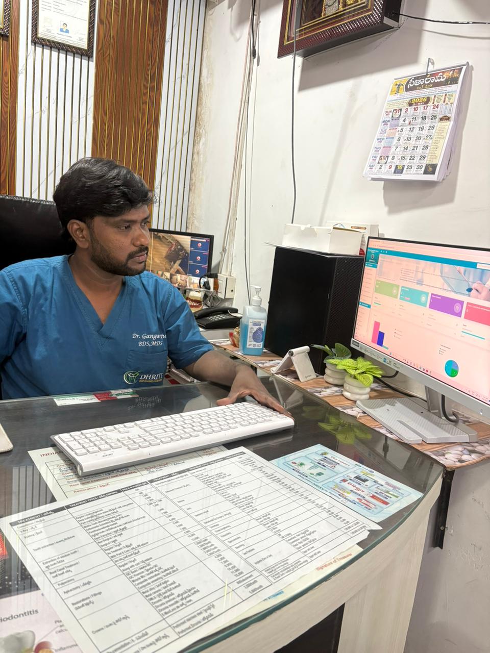 Dr. Gangaraju at the Dhriti Dental practice management desk