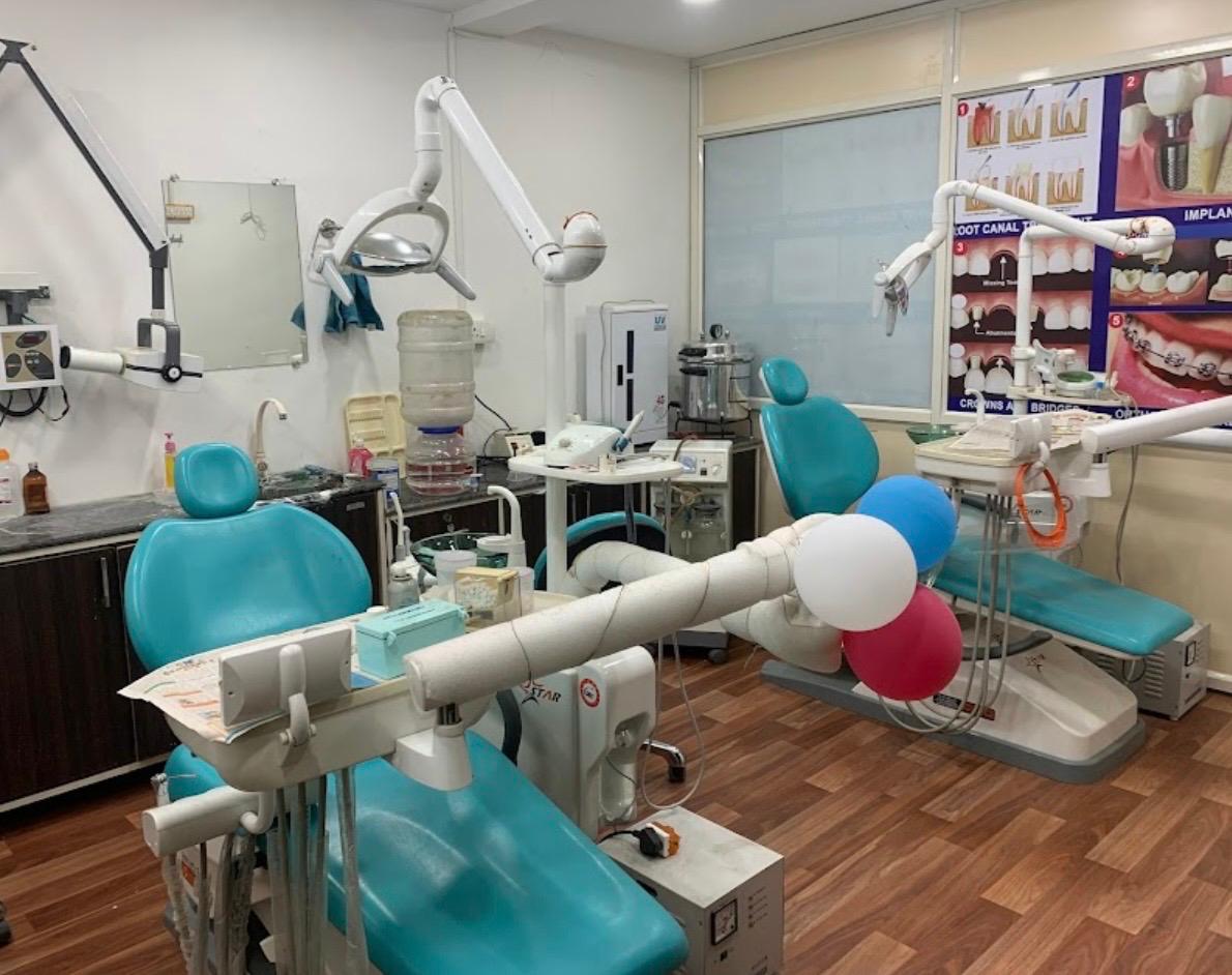 Modern dental treatment room with two patient chairs